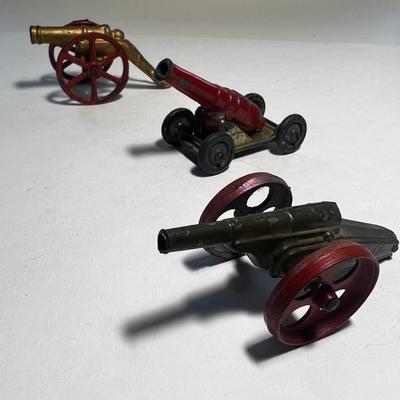 3 Red and Brass Cannons