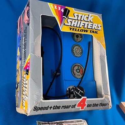 VINTAGE STICK SHIFTERS YELLOW TAIL TOY AS IS