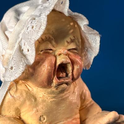 ARTIST SIGNED AND NUMBERED WAILING BABY FIGURINE