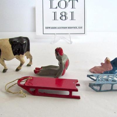 3 Vintage Lead Christmas Figures, People on Sleds, Cow