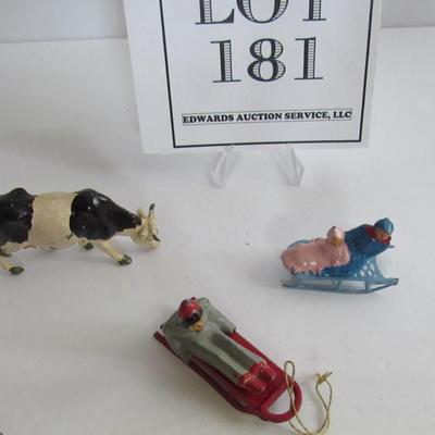 3 Vintage Lead Christmas Figures, People on Sleds, Cow