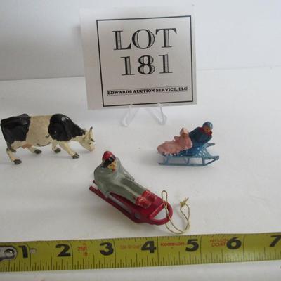 3 Vintage Lead Christmas Figures, People on Sleds, Cow