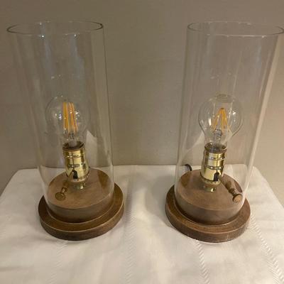 A pair of  glass cylinder  glass lamps with Edison bulbs. 12â€ high.