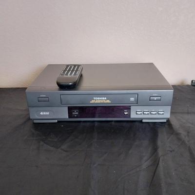 TOSHIBA VHS PLAYER WITH REMOTE AND VHS TAPES