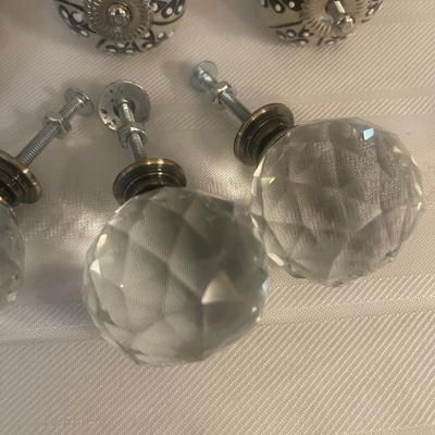 4 brand new round crystal knobs & 3 brand new ivory & blue knobs.