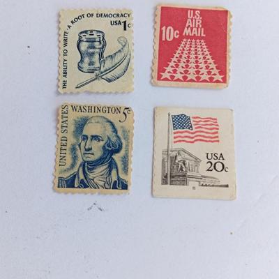 Four vintage postage stamps