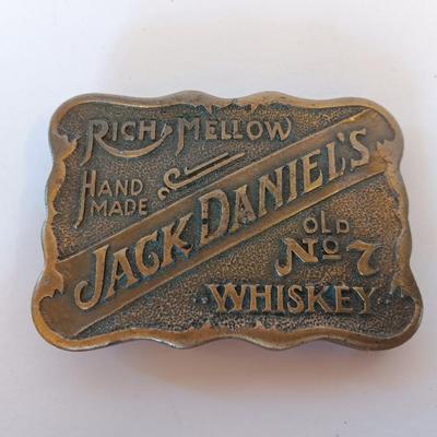 Jack Daniels belt buckle with two tobacco pipes and a fancy neck tie