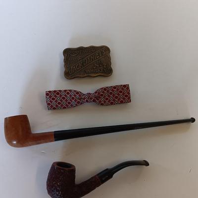 Jack Daniels belt buckle with two tobacco pipes and a fancy neck tie