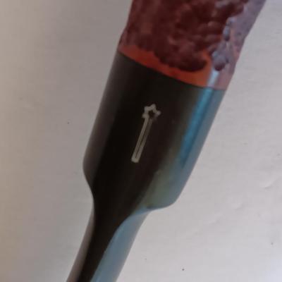 Jack Daniels belt buckle with two tobacco pipes and a fancy neck tie