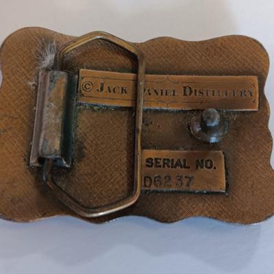 Jack Daniels belt buckle with two tobacco pipes and a fancy neck tie