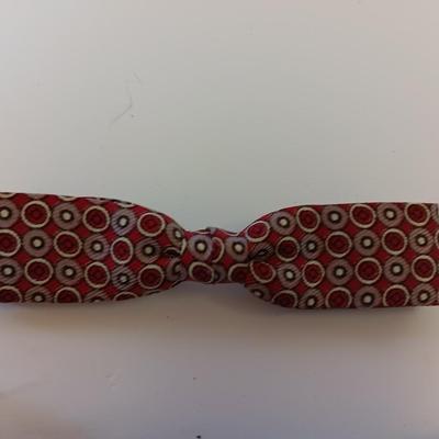 Jack Daniels belt buckle with two tobacco pipes and a fancy neck tie