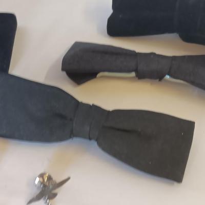 Bow ties with bolo tie and tie pins