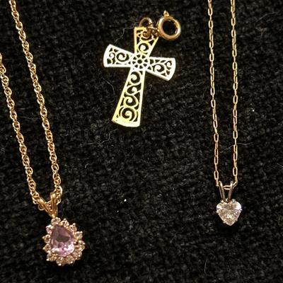 Gold tone necklaces, charms & rings