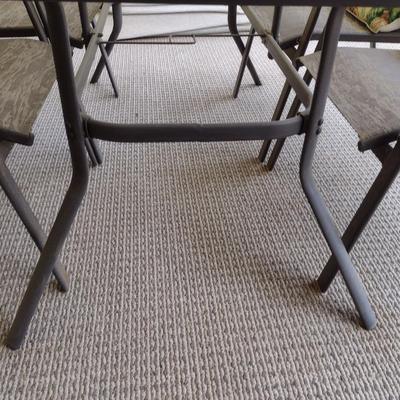 Glass Top Metal Frame Patio Table with Set of Four Mesh Chairs includes Umbrella (No Contents)
