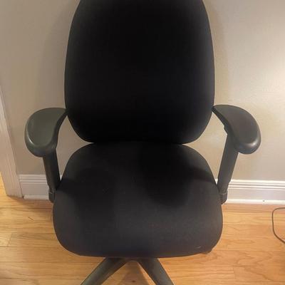 Black office chair. Swivels, rolls, has adjustable seat, back & height