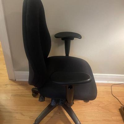 Black office chair. Swivels, rolls, has adjustable seat, back & height