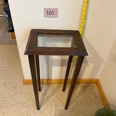 Small glass top wooden table