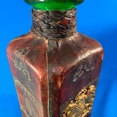 MYSTERIOUS LEATHER COVERED GLASS JAR WITH STOPPER AND METALLIC CREST 