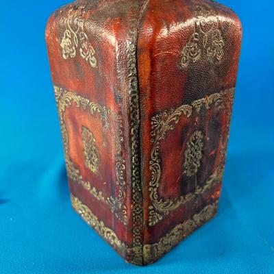 MYSTERIOUS LEATHER COVERED GLASS JAR WITH STOPPER AND METALLIC CREST 