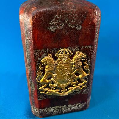 MYSTERIOUS LEATHER COVERED GLASS JAR WITH STOPPER AND METALLIC CREST 