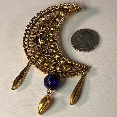 MYSTERIOUS DANGLY OPEN WORK MOON AND BLUE BEAD PIN