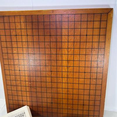 The Go Game Heavy tabletop wooden board with vintage black and white stones. Good ondition