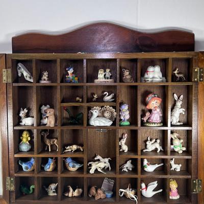 Wall mounted wood shadow box with collectible smalls
