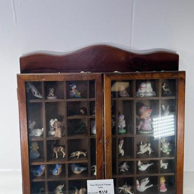 Wall mounted wood shadow box with collectible smalls