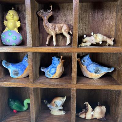 Wall mounted wood shadow box with collectible smalls
