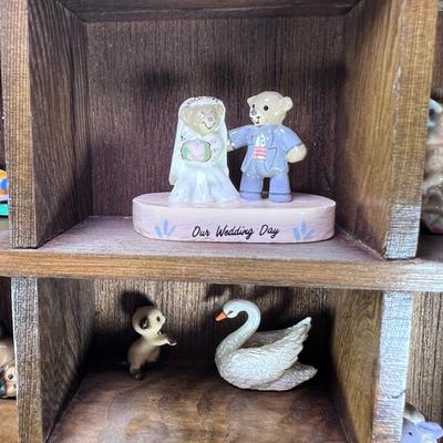 Wall mounted wood shadow box with collectible smalls