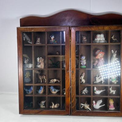 Wall mounted wood shadow box with collectible smalls