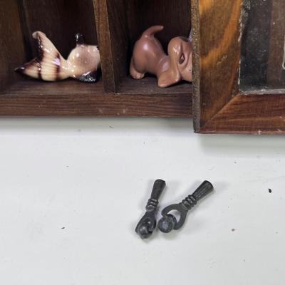 Wall mounted wood shadow box with collectible smalls