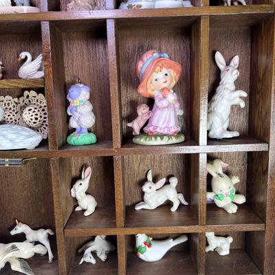 Wall mounted wood shadow box with collectible smalls