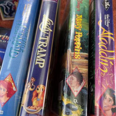 13 Disney VHS tapes 1 audio book in decorative Large  basket