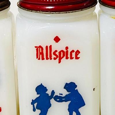 Vintage milk glass spice shakers