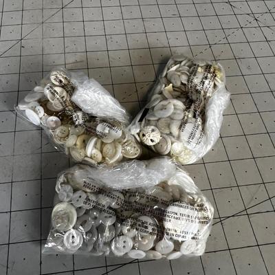 a Bag of white Buttons 