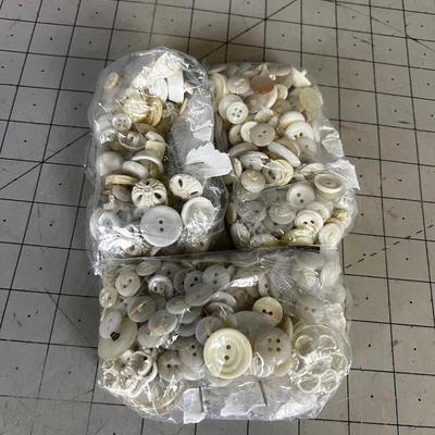 a Bag of white Buttons 