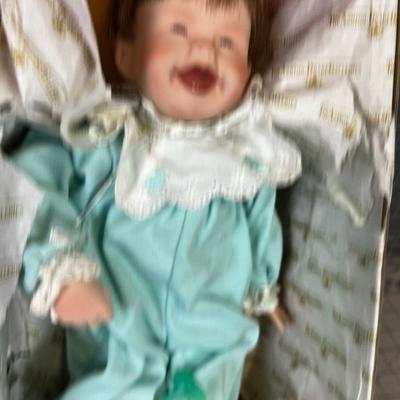 Porcelain Baby Doll in Blue Jumper