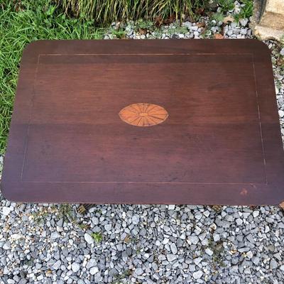 Antique dark wood table with inlay and brass feet