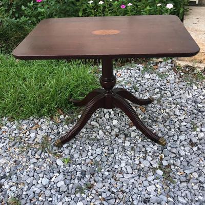 Antique dark wood table with inlay and brass feet