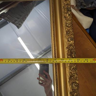 Beautiful  ornate gold framed wall mirror.
