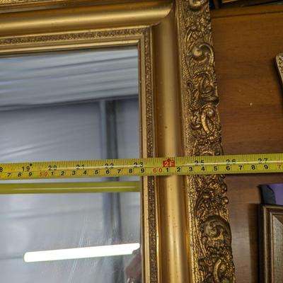 Beautiful  ornate gold framed wall mirror.