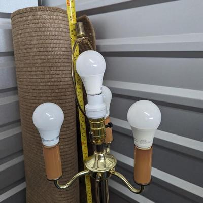 unique floor lamp with white lamp shade.