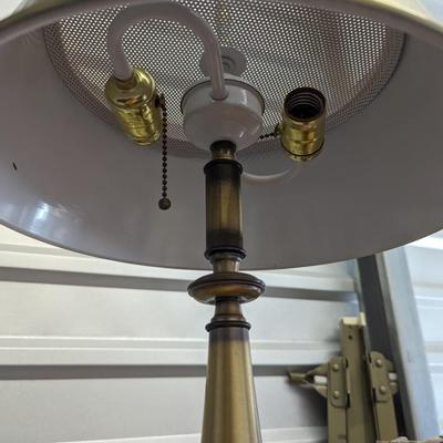 Nice mid century burnished brass lamp with round metal shade.
