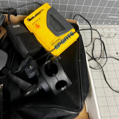 Box of Electronics and Accessories: Camera, Walkman, Game Controller 