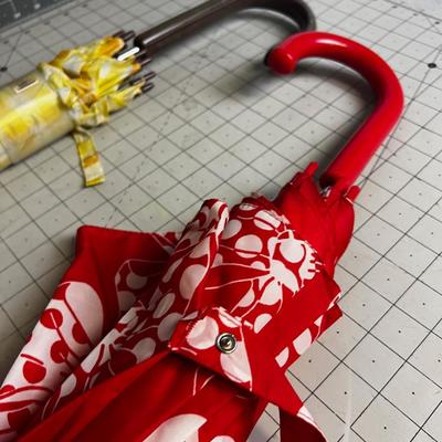 2 Umbrella - Red and a yellow one! 