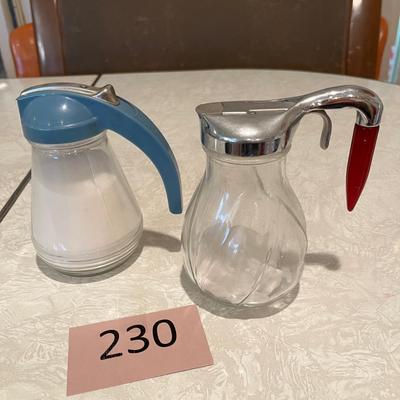 Two vintage syrup dispensers