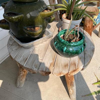 Round outdoor wood table with planters