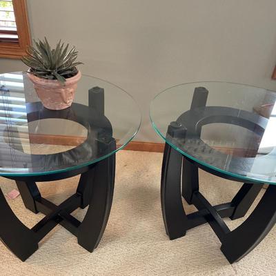 2 round glass top tables
