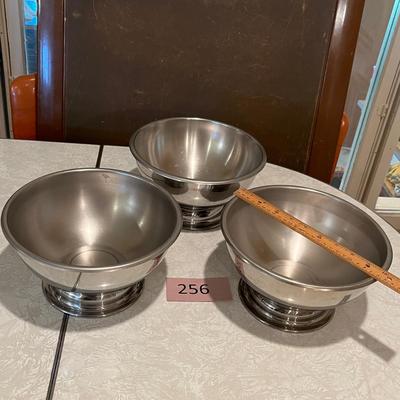 Three stainless still pedestal bowls